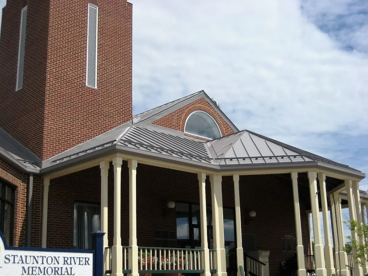 Skilled roofing craftsmen working on a residential roof in Patriot Place
